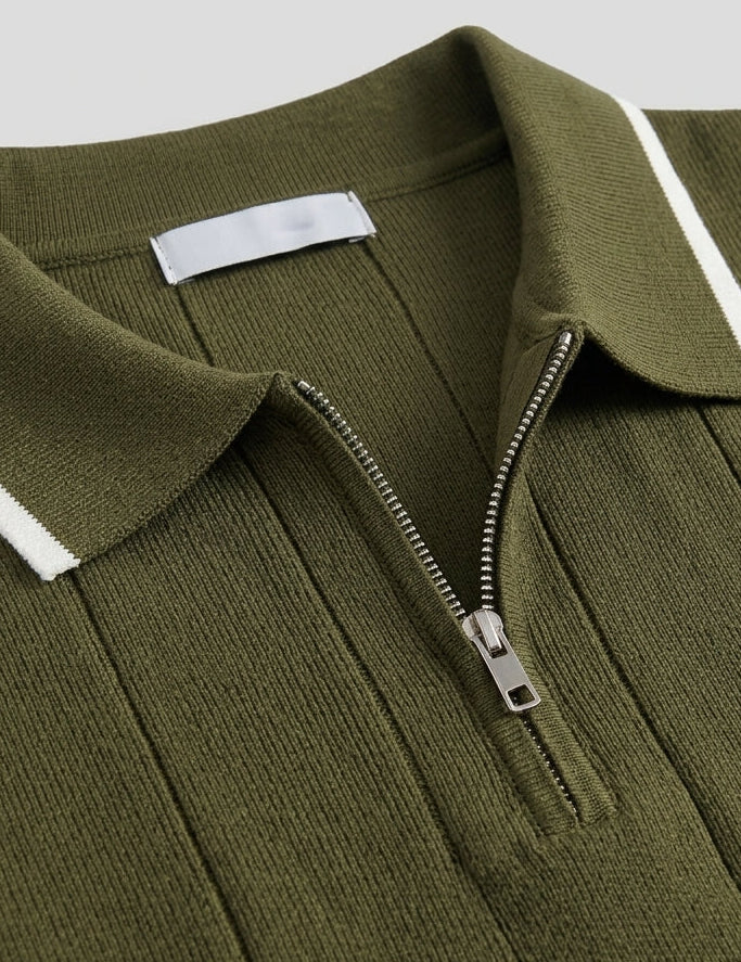 Olivo - Green polo shirt with white trim and zipper on a light gray background