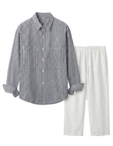 Striped shirt and white pants on a light gray background