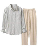 Striped shirt and beige pants on a light gray background
