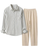 Striped shirt and beige pants on a light gray background