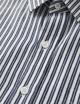 Close-up of a blue and white striped shirt with buttons.