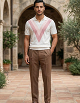 Rosato - Man standing in a courtyard with stone arches and potted plants