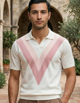 Rosato - Man wearing a white polo shirt with pink V-shaped design outdoors.