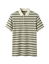 Striped polo shirt with green and white stripes on a gray background