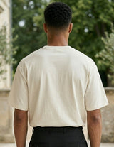 Top back - Cream white men’s cotton crew neck T-shirt with small chest graphic