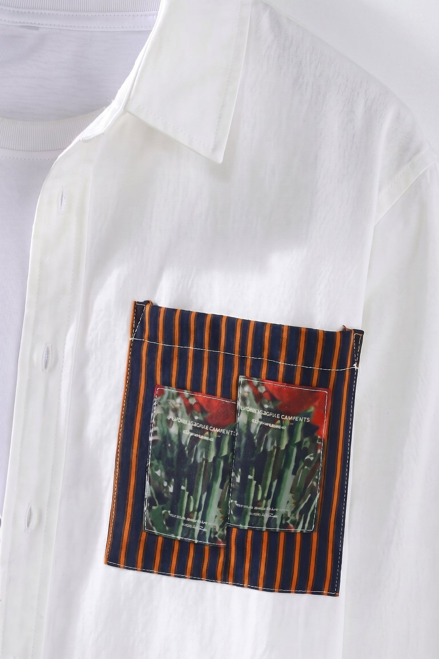 Top fabric detail - White men’s patchwork button-up shirt with brown striped panels