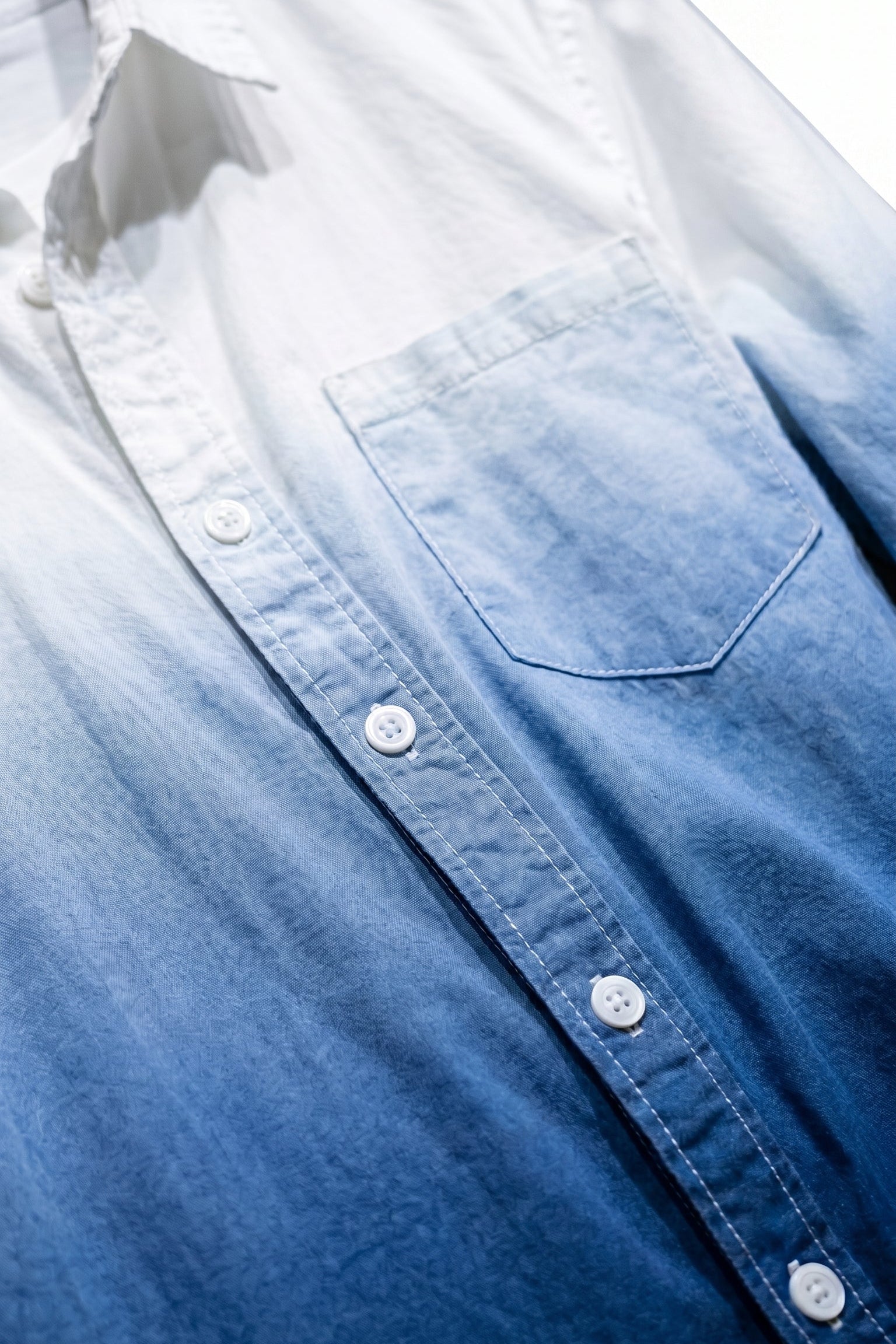 Top fabric detail - White and blue gradient men’s cotton button-up shirt