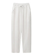 White drawstring relaxed-fit pants with straight legs on a white background.