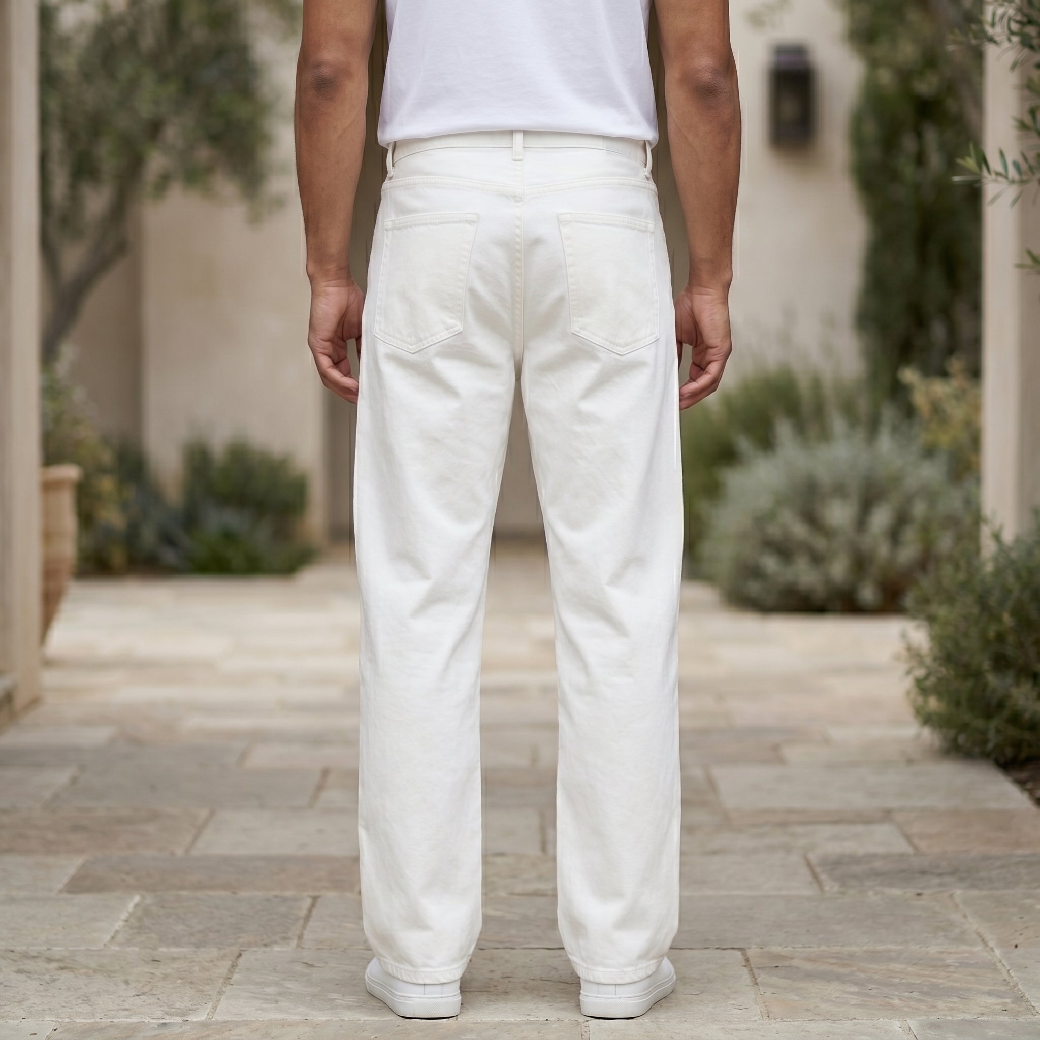 White men’s ribbed straight-leg trousers with pockets and button waistband back view