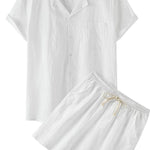 White pajama set with a shirt and shorts on a gray background