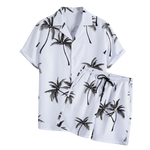 White palm print short-sleeve button-up summer shirt on a white background.