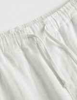White pants with a belt on a white background