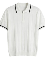 White polo shirt with black trim on a light gray background