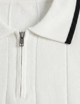 White zip-up hoodie with black trim on a light gray background